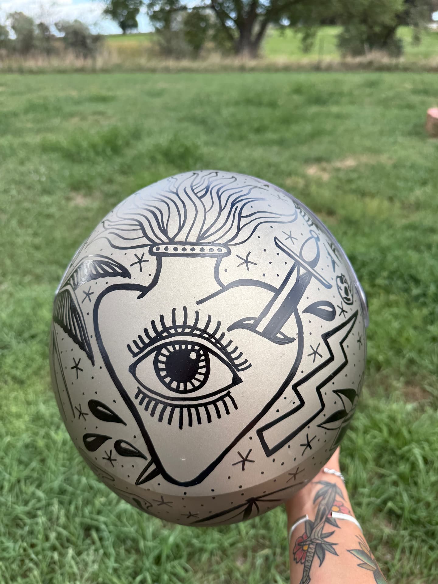 Helmet crown hand-painted with an all-seeing eye and crown